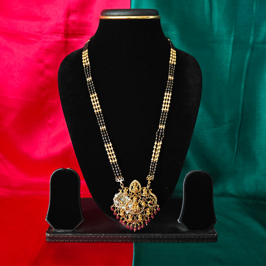 Beautiful Black Beads Long With Laxmi Idol In Ruby Coloured Crystal